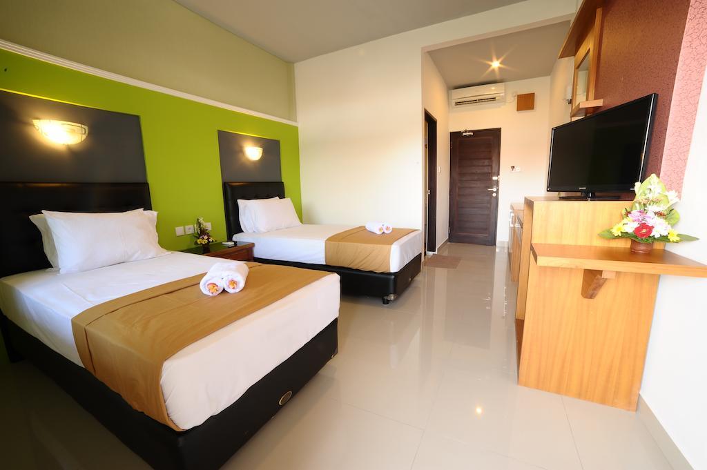 Sandat Hotel Kuta Кута Стая снимка